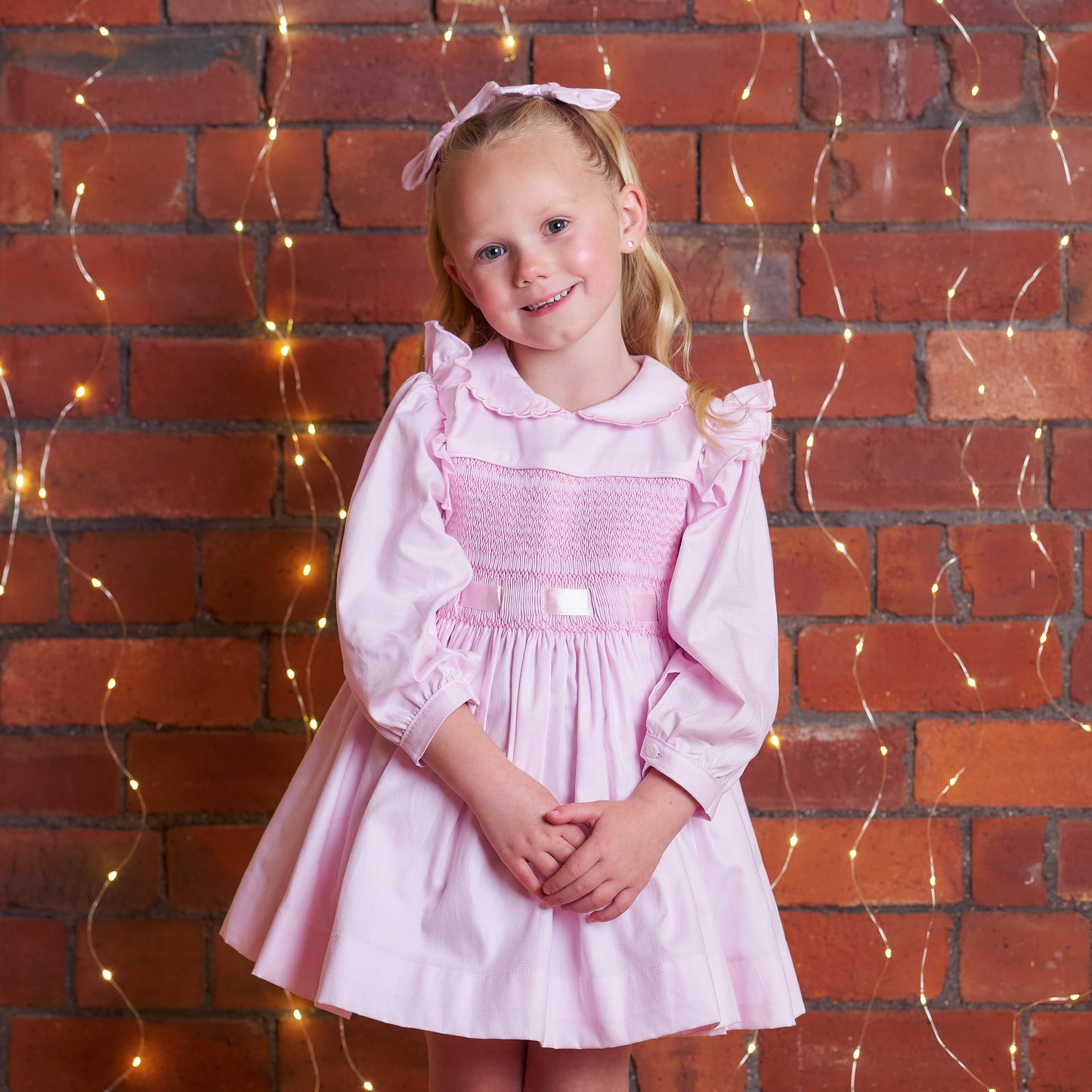 Hand smocked pink Fifi dress with pant and bows