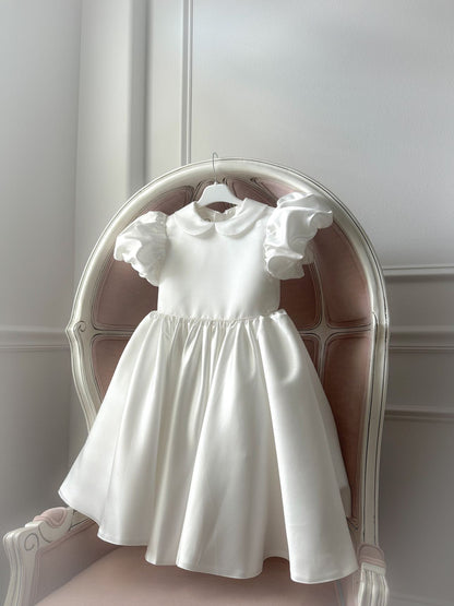 White satin puff sleeved occasion dress