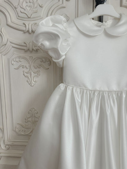 White satin puff sleeved occasion dress