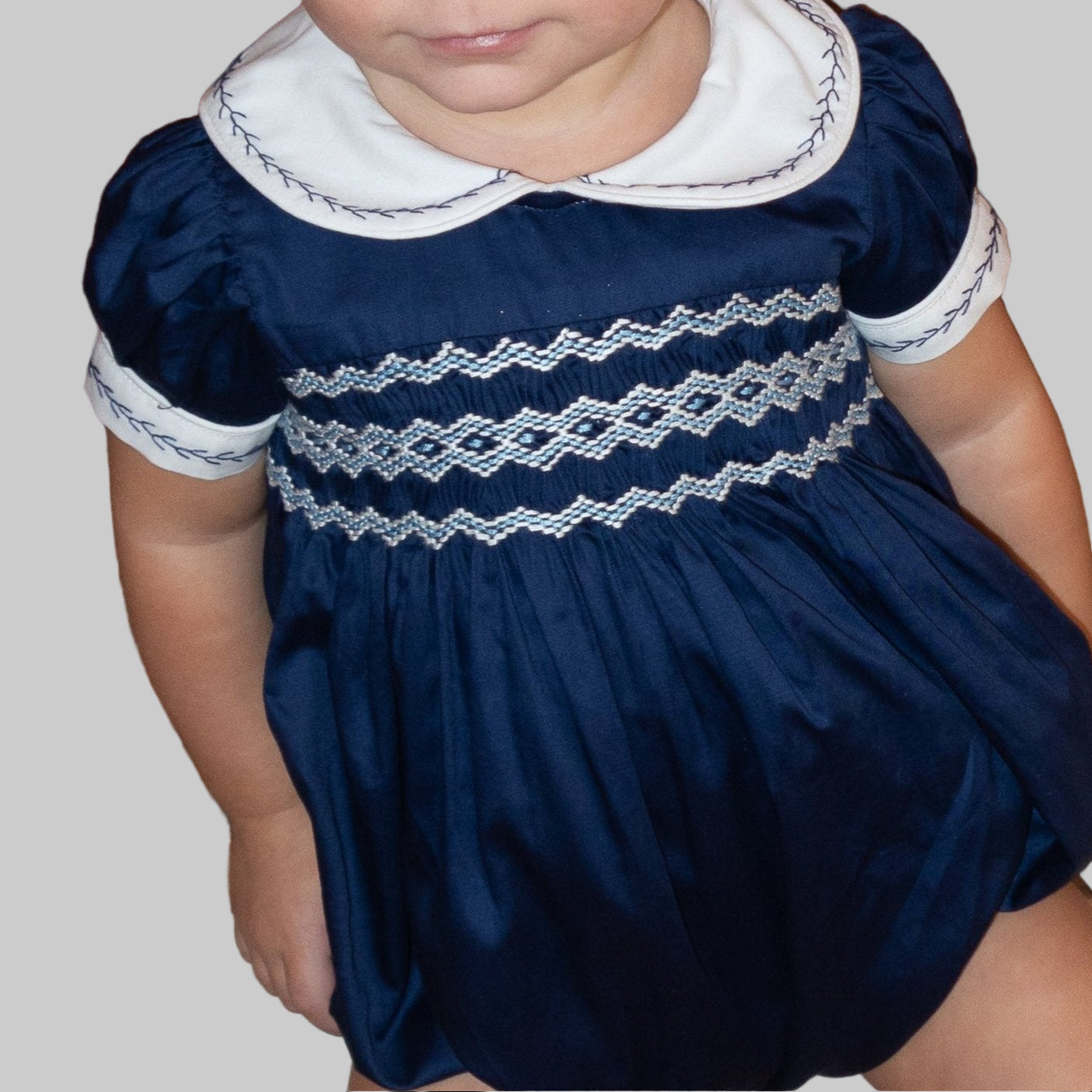 Navy Blue Hand Smocked REGAL Romper