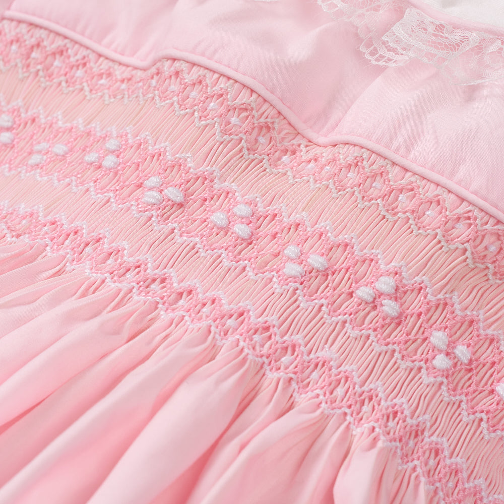 Hand Smocked Ellis romper soft pink