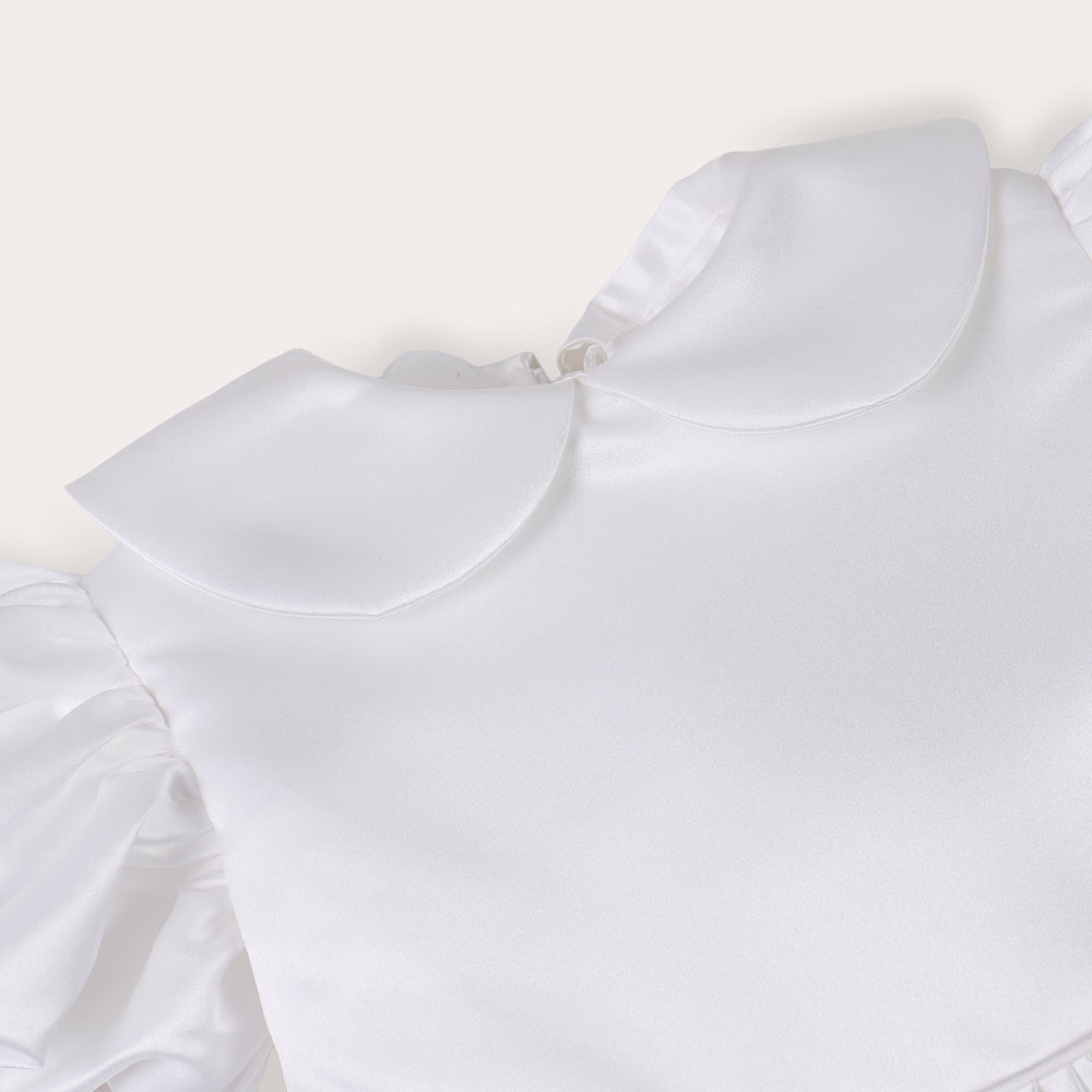 White satin puff sleeved occasion dress