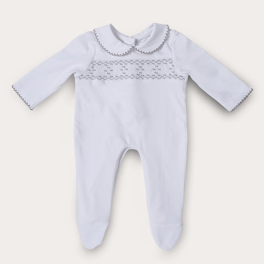 Hand smocked cotton babygrow with grey details