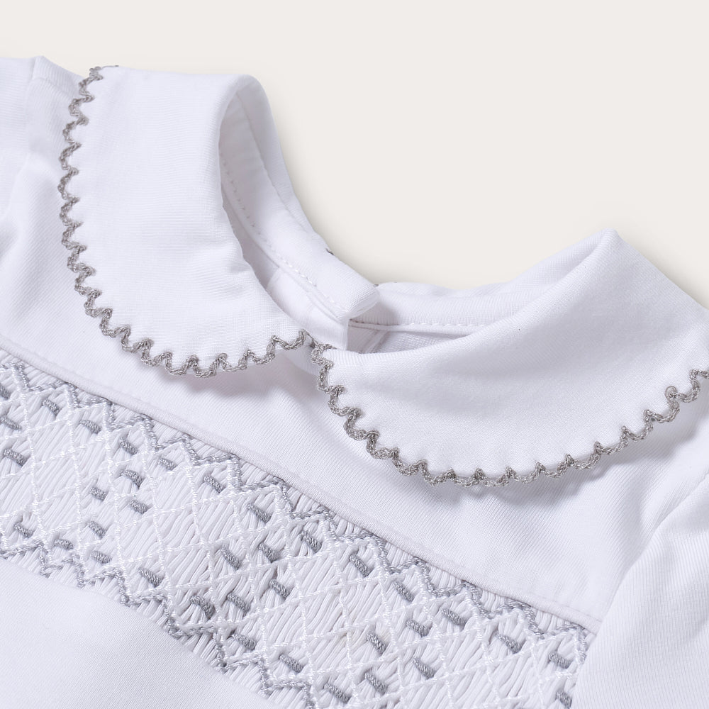 Hand smocked cotton babygrow with grey details