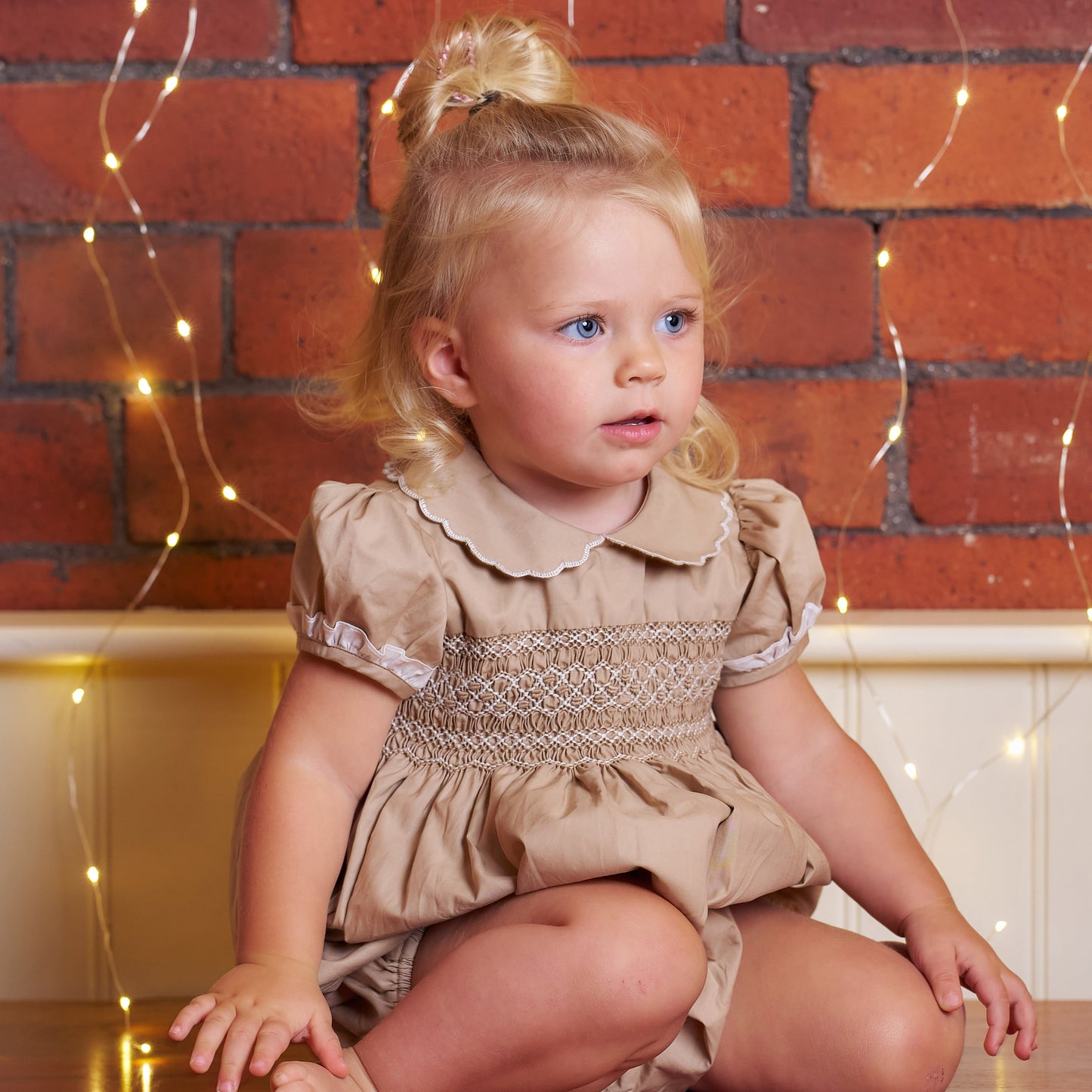 Hand Smocked Talia romper coffee cream