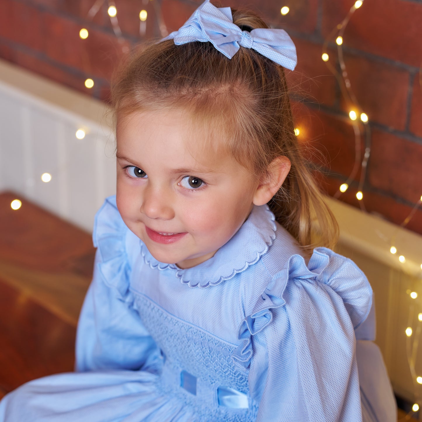 Hand smocked blue Fifi dress with pant and bows
