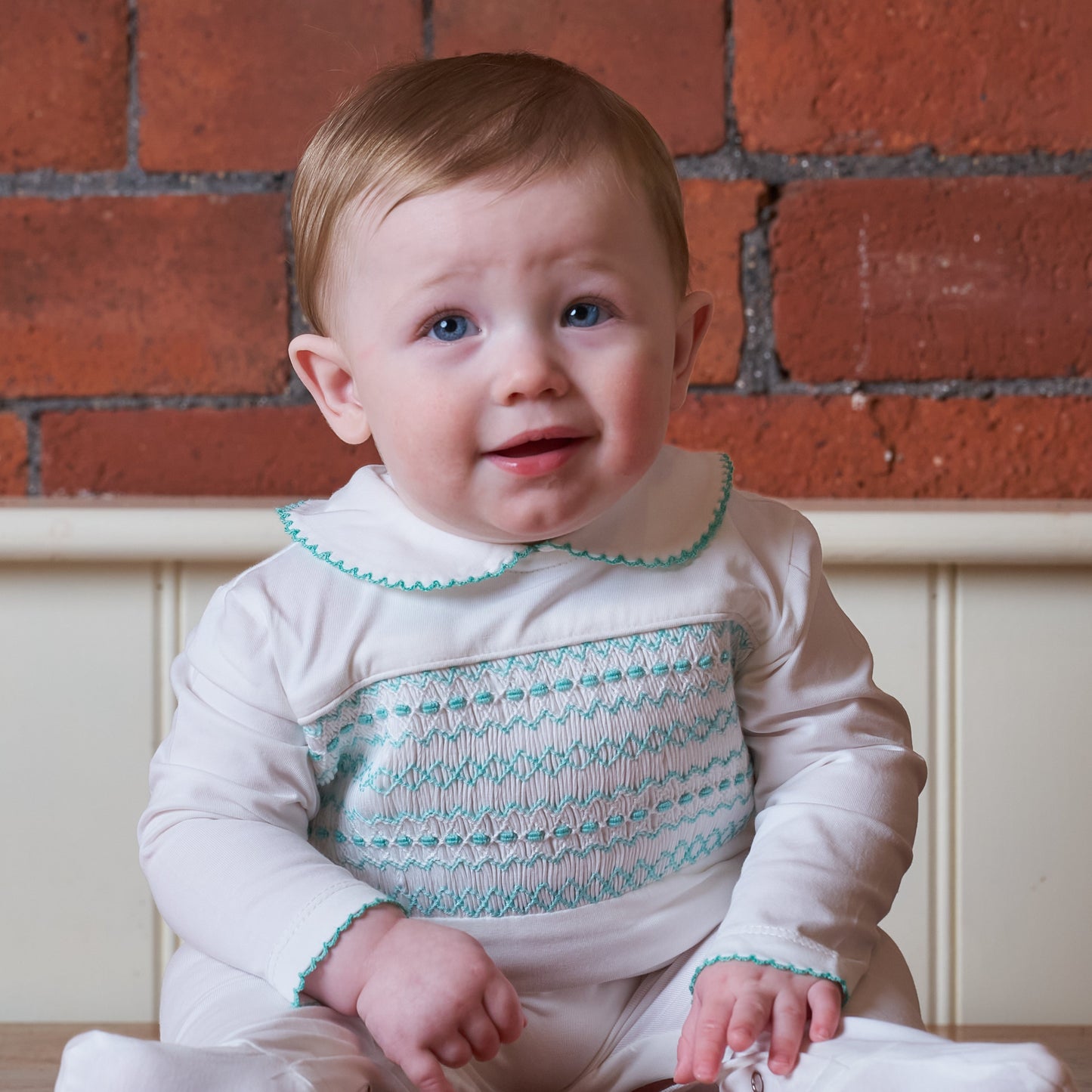 Hand Smocked White Baby Grow With Soft Green Hand Smocking