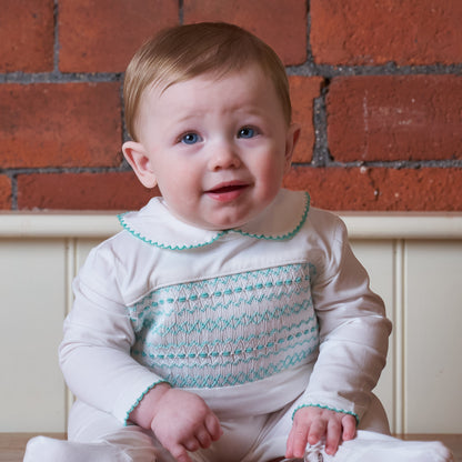 Hand Smocked White Baby Grow With Soft Green Hand Smocking