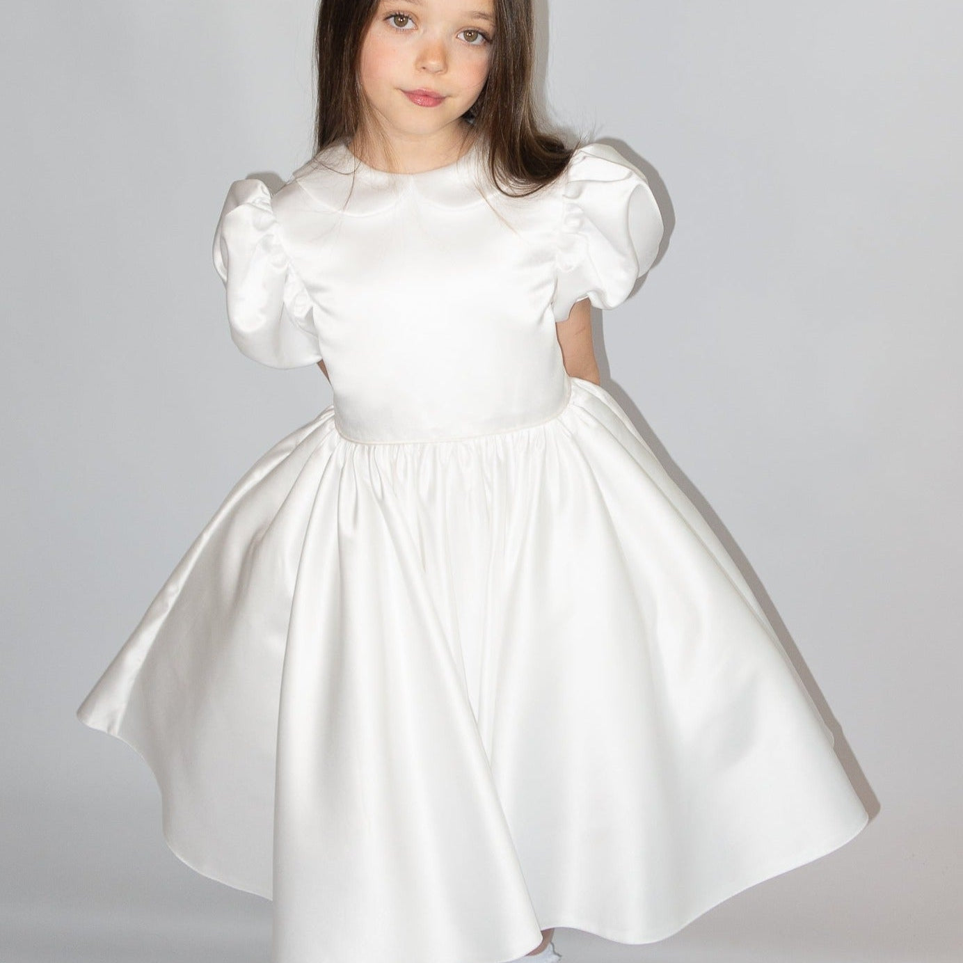 White satin puff sleeved occasion dress