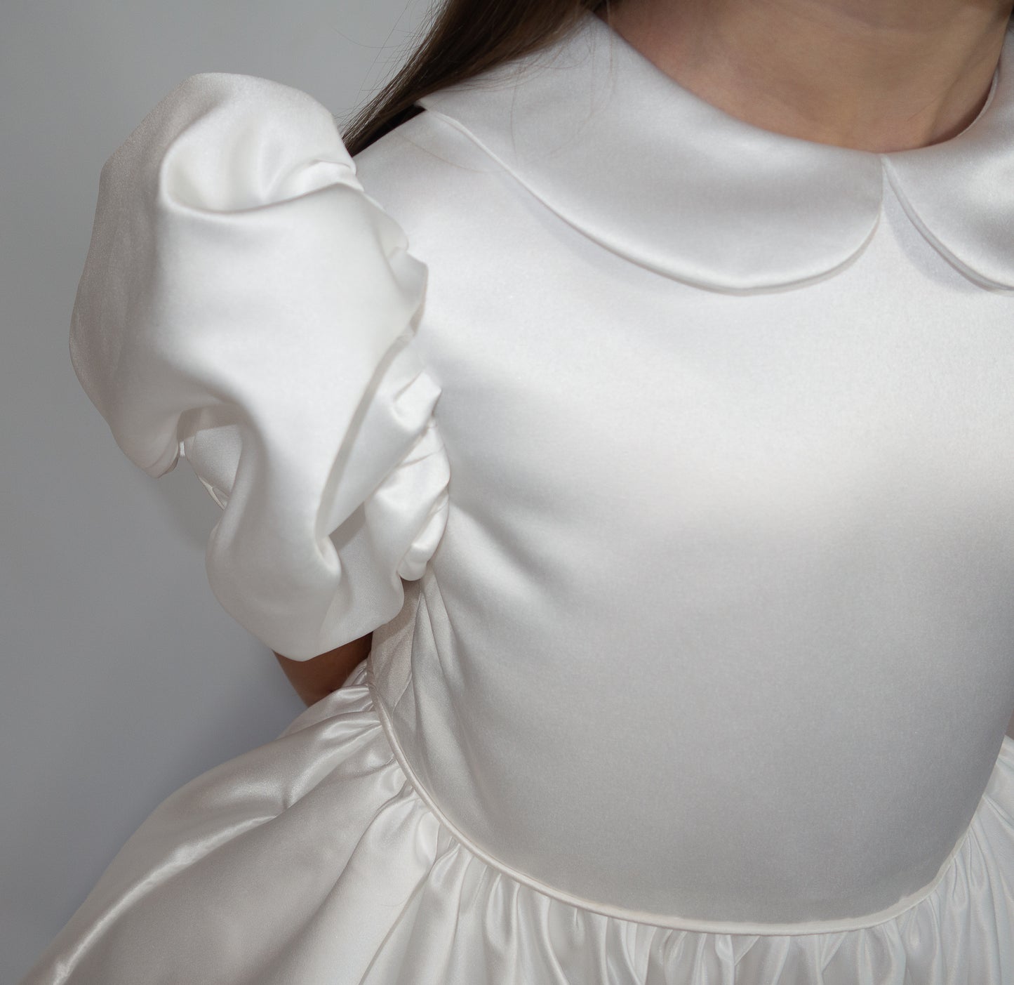 White satin puff sleeved occasion dress
