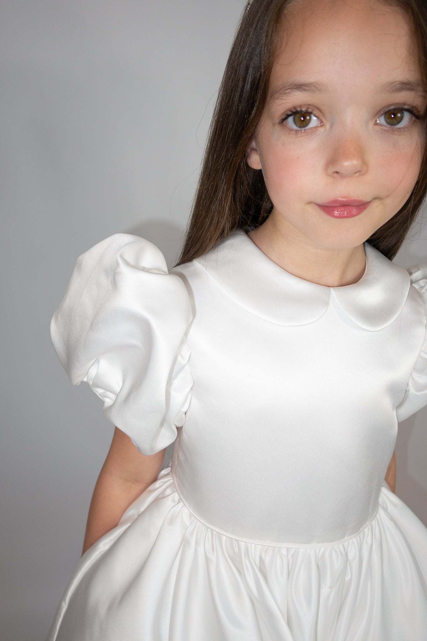 White satin puff sleeved occasion dress