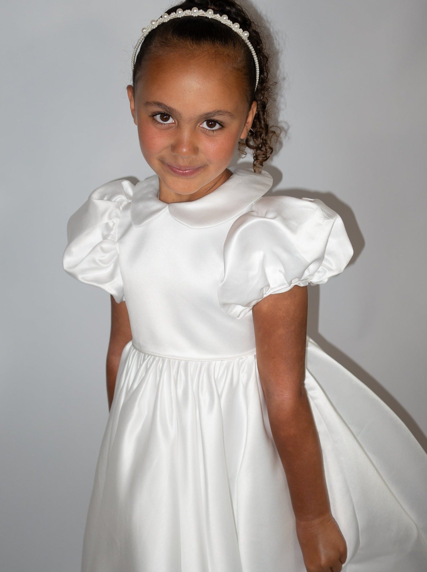White satin puff sleeved occasion dress