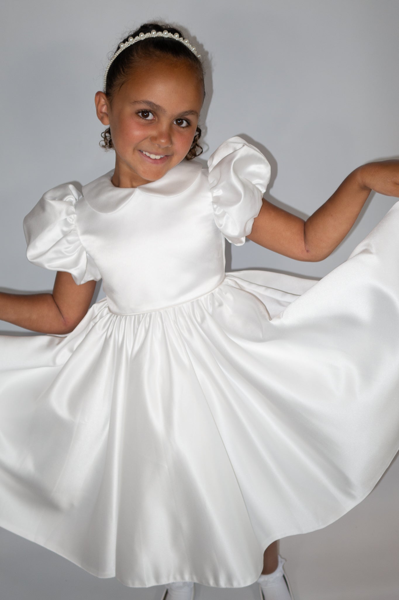 White satin puff sleeved occasion dress