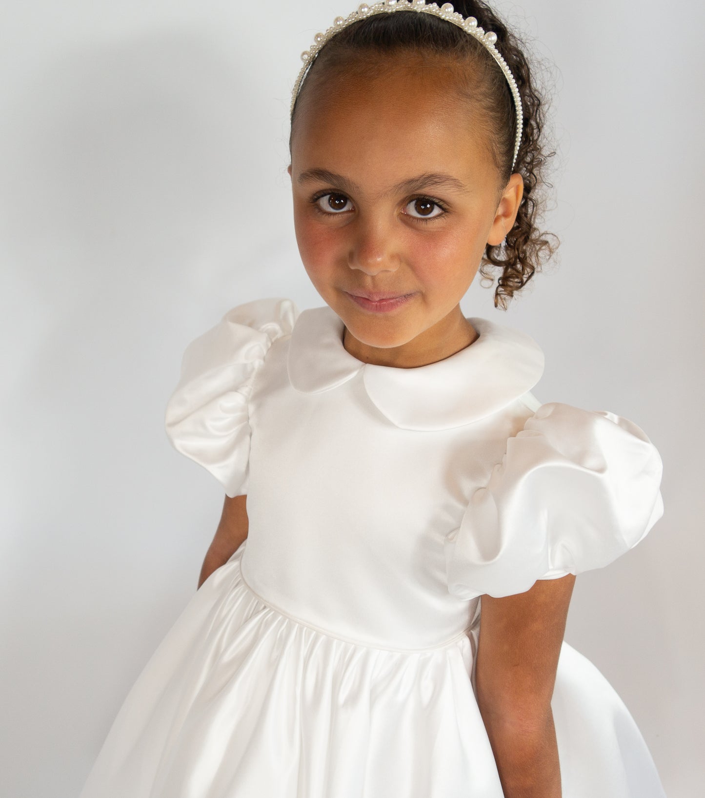 White satin puff sleeved occasion dress