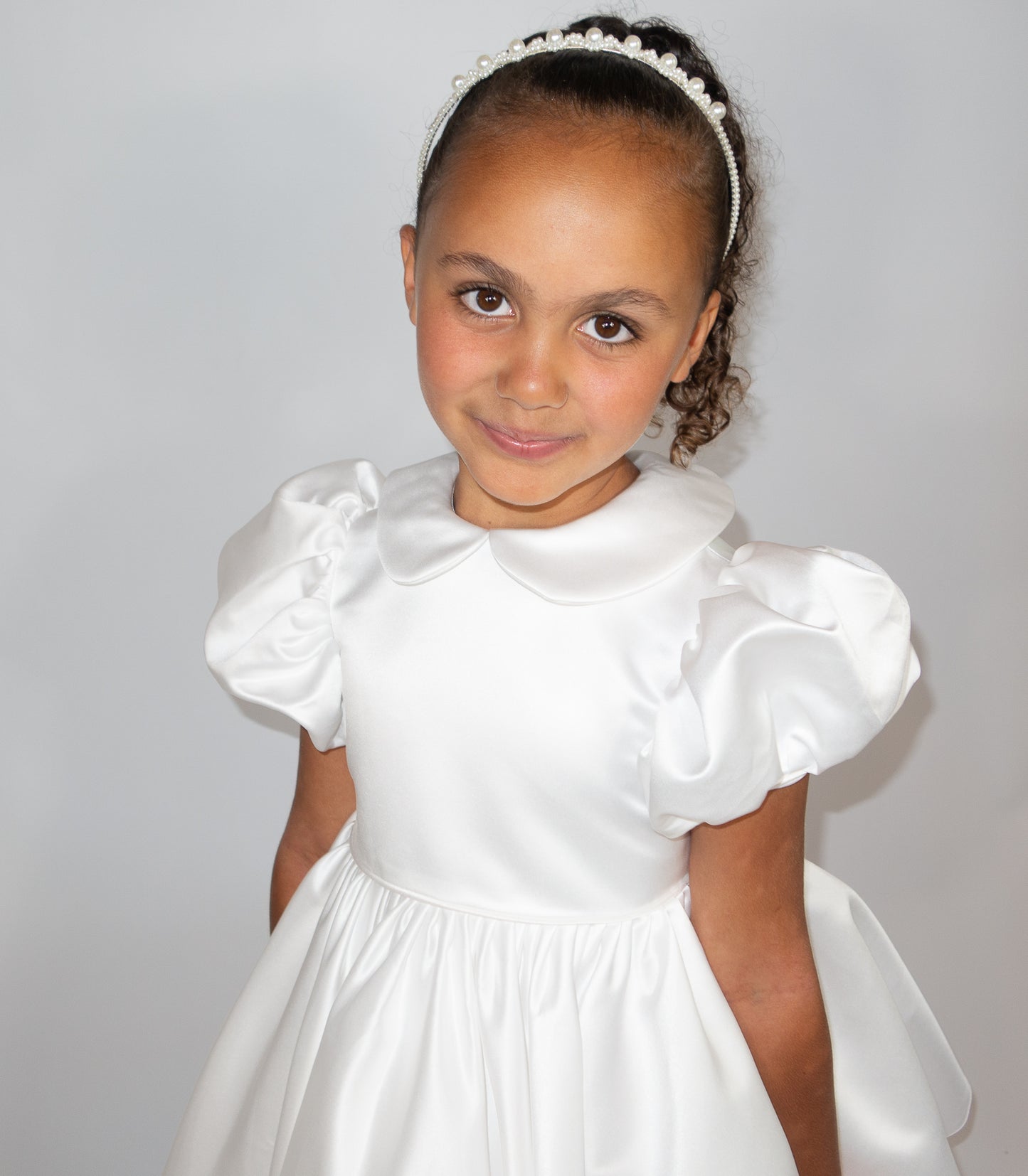 White satin puff sleeved occasion dress