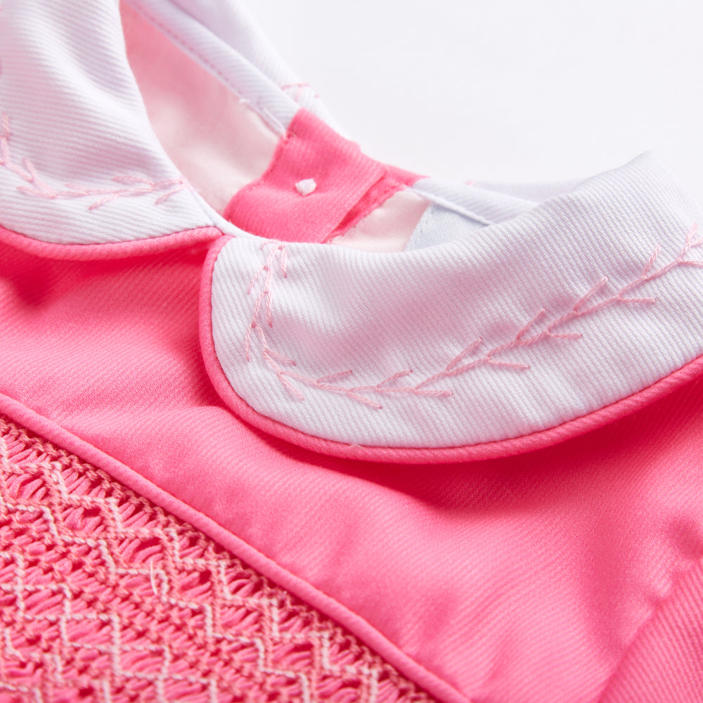 Pink smocked full sleeved romper